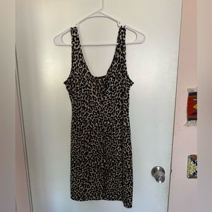 Vintage Cheetah print mini dress! Fits like a size medium, accentuates curves.